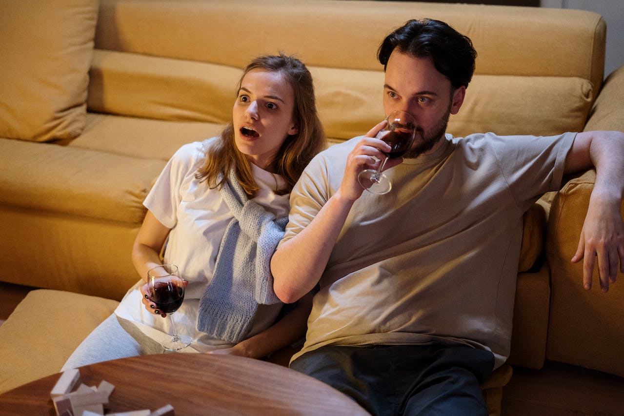 Couple watching TV after DStv Explora installation